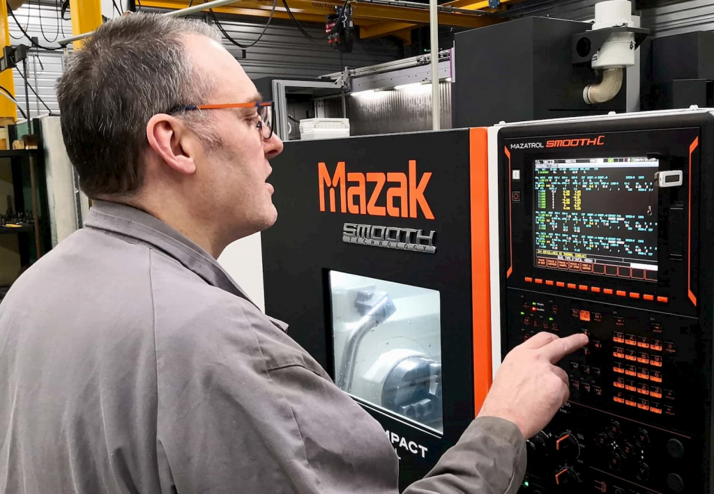 Engineer working on a Mazak machine