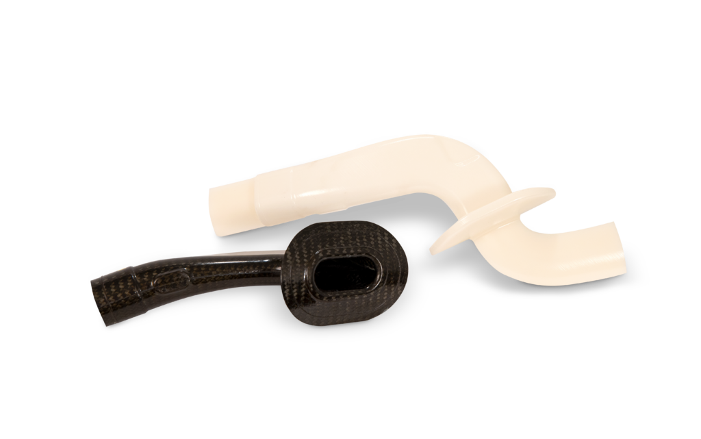 Accura AMX Durable Natural 3D printed parts showcasing high-strength, flexible resin for industrial tooling and production applications.
